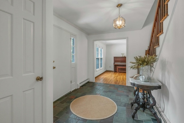 foyer entrance featuring a baseboard radiator and ornamental molding