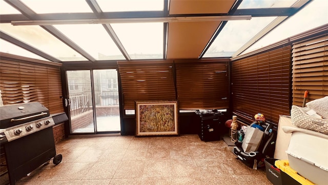 sunroom / solarium with lofted ceiling with skylight