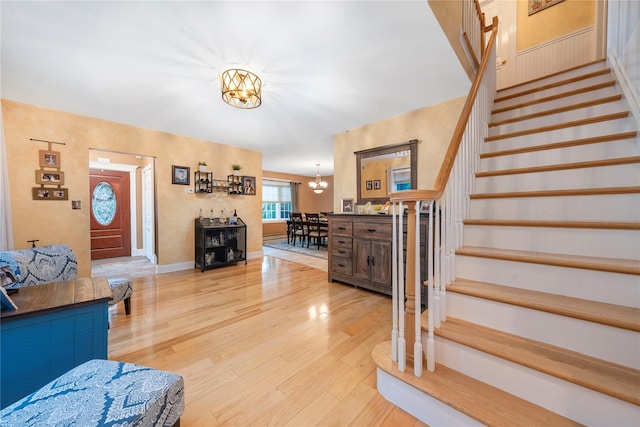 interior space featuring a notable chandelier and light hardwood / wood-style floors