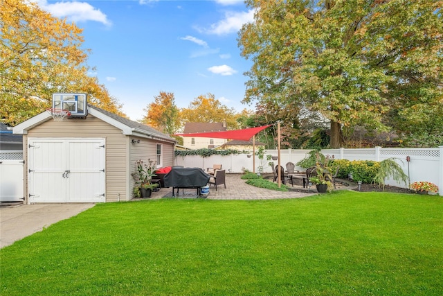 view of yard with a patio and a storage shed