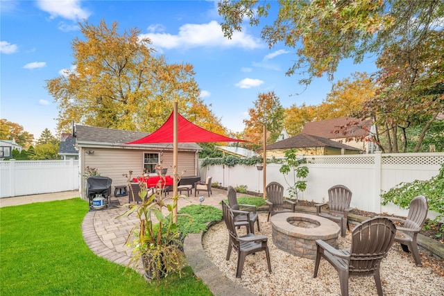 view of patio featuring grilling area and an outdoor living space with a fire pit