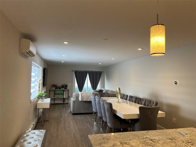 dining space with dark wood-type flooring and a wall unit AC