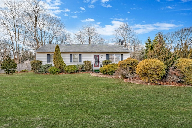 single story home with a front lawn