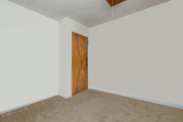 spare room with light colored carpet