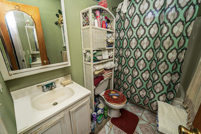 bathroom featuring vanity, a shower with curtain, tile patterned floors, and toilet