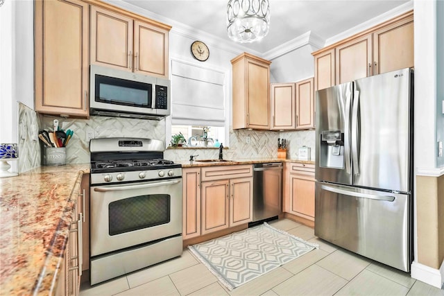 192 Bch 74th St, Arverne, NY 11692 - kitchen featuring appliances with stainless steel finishes, a sink, decorative backsplash, ornamental molding, and light stone counters