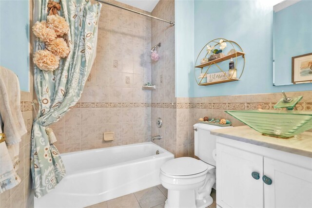 192 Bch 74th St, Arverne, NY 11692 - bathroom featuring tile walls, tile patterned flooring, shower / bath combo, toilet, and vanity