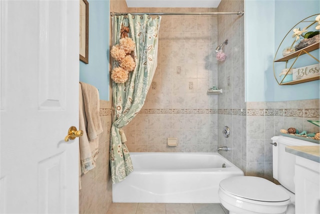 192 Bch 74th St, Arverne, NY 11692 - full bathroom with tile walls, shower / tub combo, toilet, tile patterned floors, and a wainscoted wall