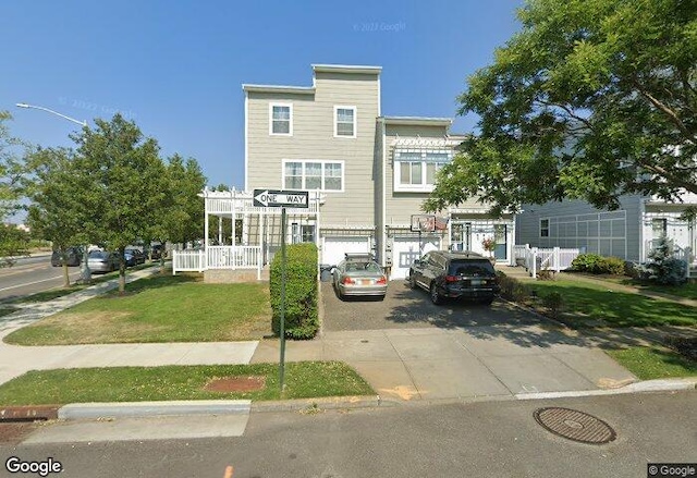 192 Bch 74th St, Arverne, NY 11692 - view of property with driveway and a garage