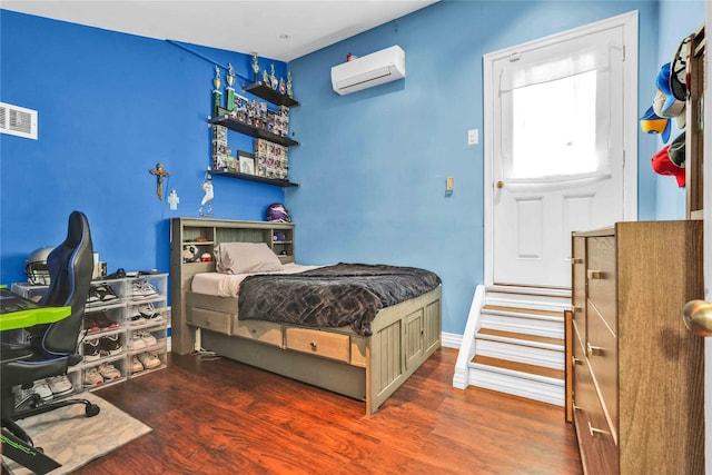 192 Bch 74th St, Arverne, NY 11692 - bedroom featuring a wall mounted air conditioner, wood finished floors, and baseboards