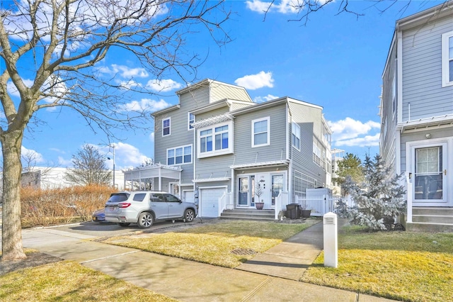 192 Bch 74th St, Arverne, NY 11692 - multi unit property with a front yard, driveway, and entry steps