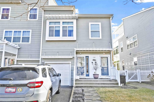 192 Bch 74th St, Arverne, NY 11692 - view of property featuring fence and an attached garage