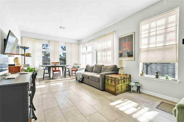 192 Bch 74th St, Arverne, NY 11692 - living area with light tile patterned flooring and baseboards