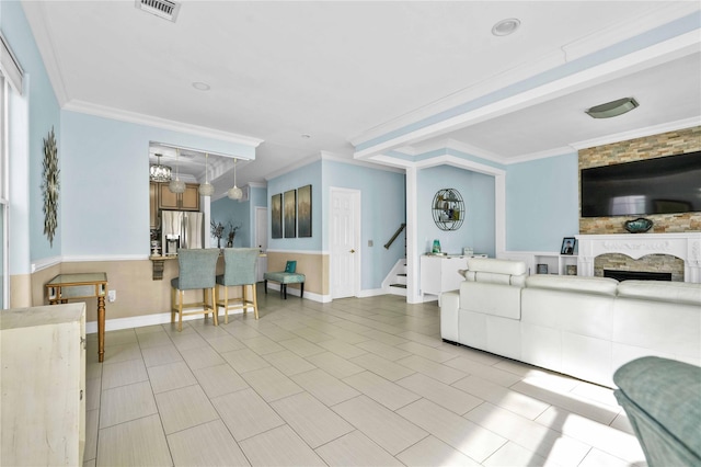 192 Bch 74th St, Arverne, NY 11692 - living area with stairs, ornamental molding, baseboards, a premium fireplace, and tile patterned flooring