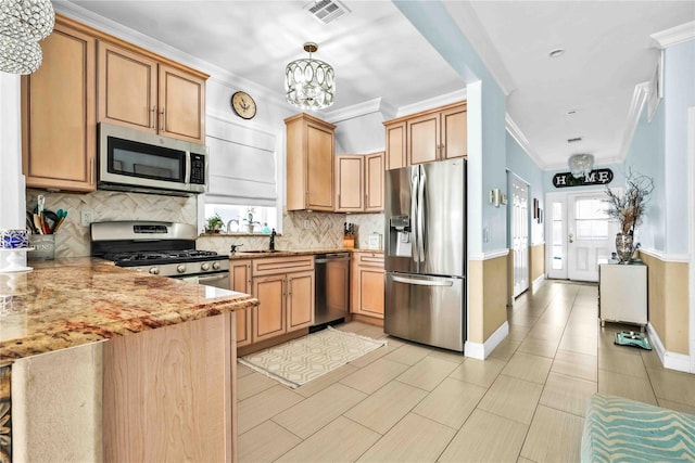 192 Bch 74th St, Arverne, NY 11692 - kitchen with appliances with stainless steel finishes, backsplash, a chandelier, crown molding, and a peninsula