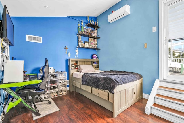 192 Bch 74th St, Arverne, NY 11692 - bedroom featuring a wall mounted air conditioner and wood finished floors