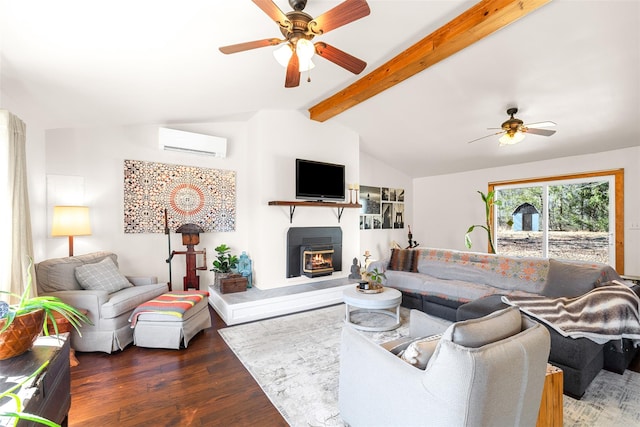 living room with a glass covered fireplace, a wall unit AC, ceiling fan, wood finished floors, and vaulted ceiling with beams