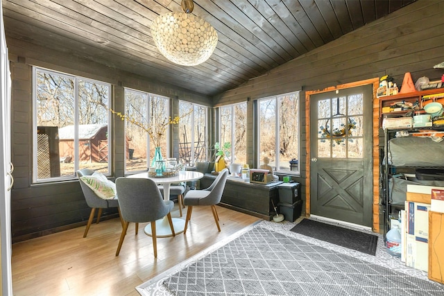 sunroom / solarium with lofted ceiling and wood ceiling