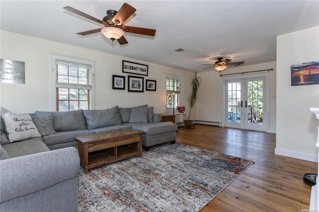 living room with visible vents, wood finished floors, french doors, baseboards, and ceiling fan