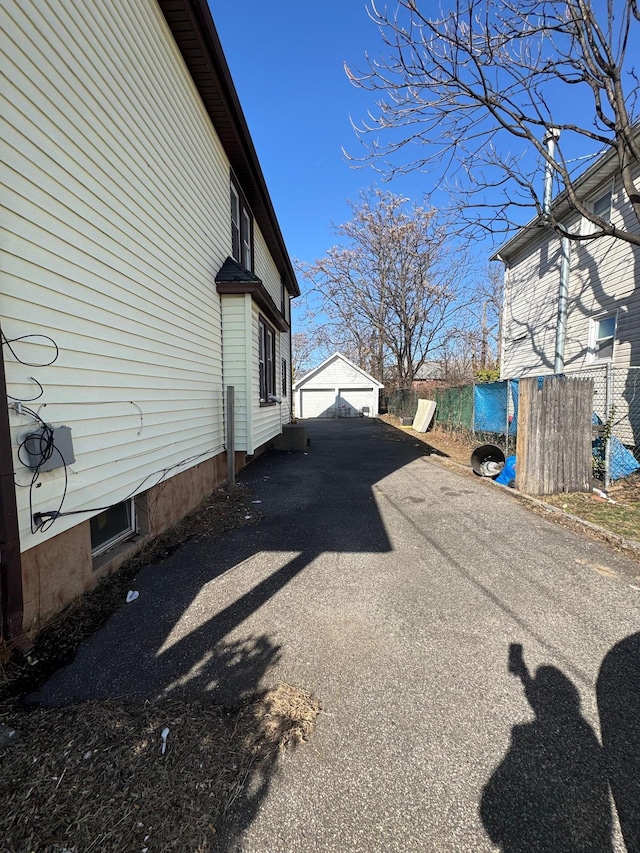 view of property exterior with fence