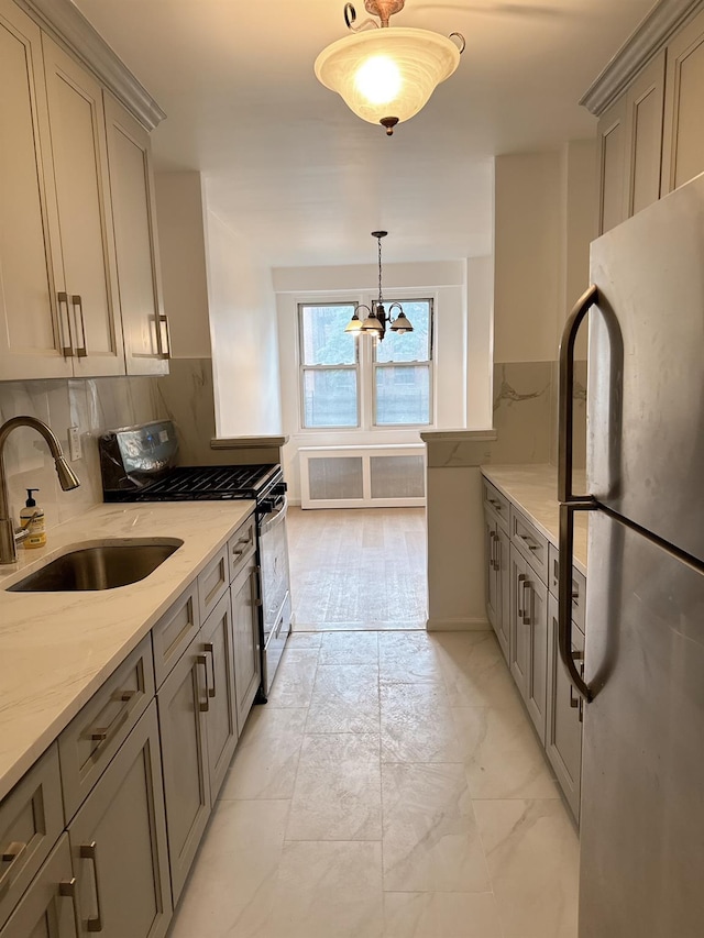 138-10 Franklin Ave Unit 3L, Flushing, NY 11355 - kitchen featuring appliances with stainless steel finishes, light marble finish floors, light stone countertops, gray cabinets, and a chandelier