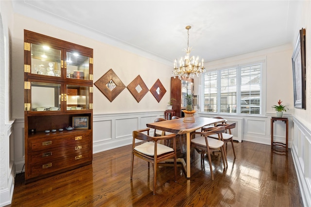 dining space featuring dark wood-type flooring and a notable chandelier