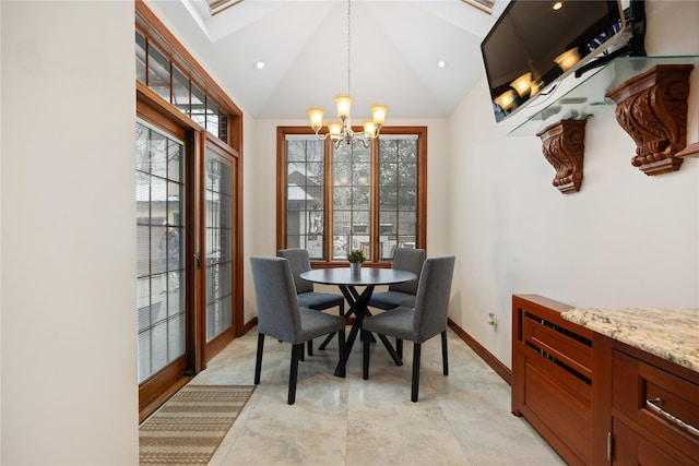 dining space with an inviting chandelier and vaulted ceiling