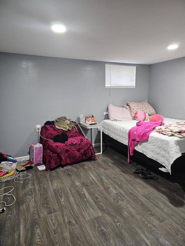 bedroom with recessed lighting and wood finished floors