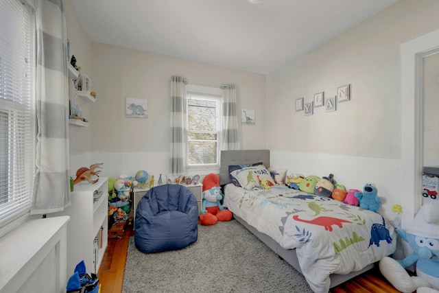 bedroom with wood-type flooring