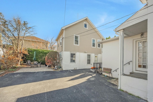 rear view of property with a patio area