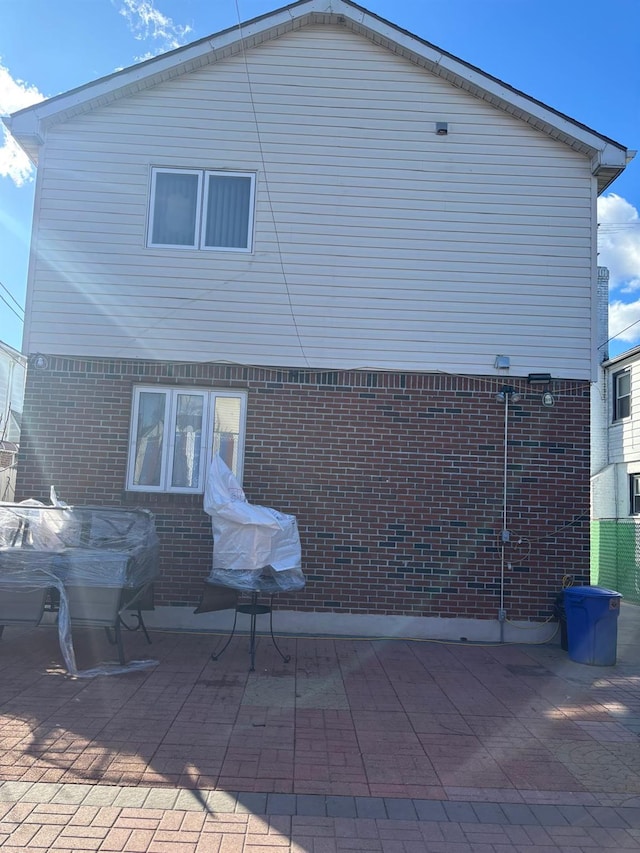 rear view of house featuring a patio area