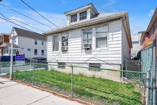 77-01 45th Ave, Flushing, NY 11373 - view of home's exterior featuring central AC unit, fence private yard, and cooling unit