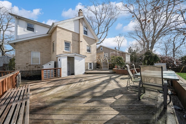 wooden deck featuring a storage shed