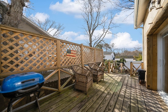 wooden deck with grilling area