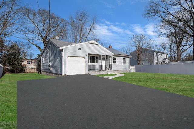 view of front of house with a garage and a front yard