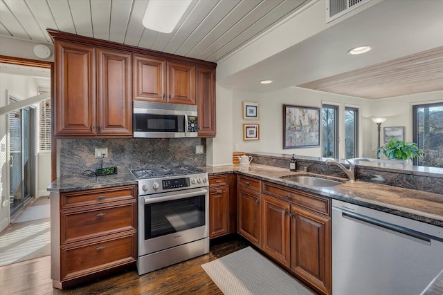 kitchen with stainless steel appliances, sink, and wood ceiling