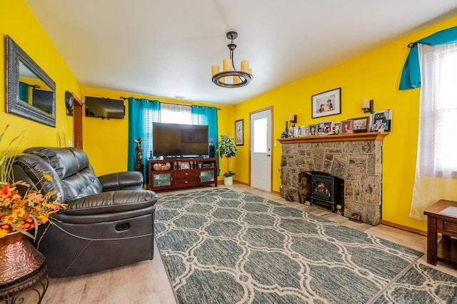 living room featuring a notable chandelier and hardwood / wood-style flooring