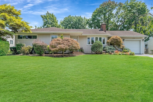 ranch-style home featuring driveway, a front lawn, a chimney, and an attached garage