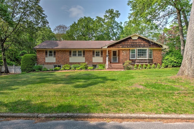 39 Cornwallis Rd, East Setauket, NY 11733 - single story home with a front yard and brick siding