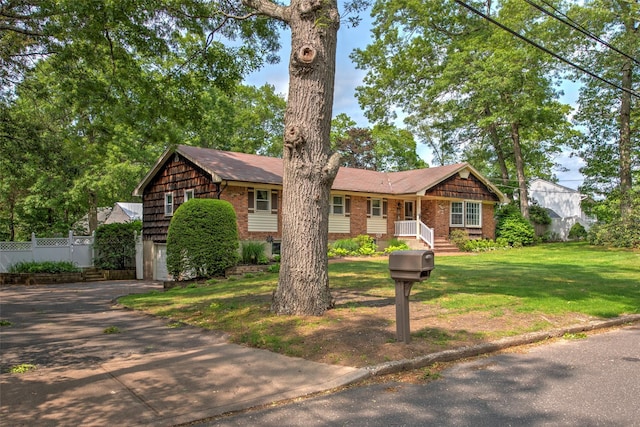 39 Cornwallis Rd, East Setauket, NY 11733 - single story home featuring brick siding, asphalt driveway, and a garage