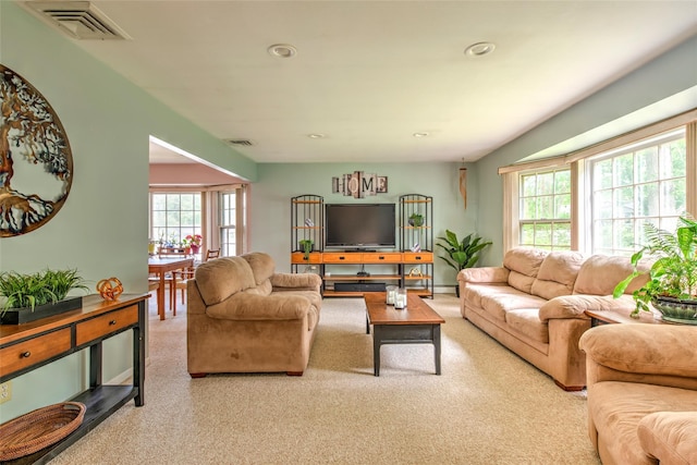 39 Cornwallis Rd, East Setauket, NY 11733 - carpeted living area featuring plenty of natural light, recessed lighting, and baseboards