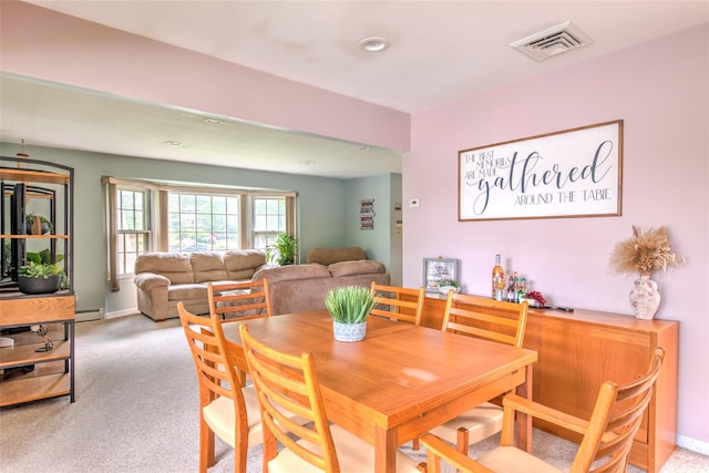 39 Cornwallis Rd, East Setauket, NY 11733 - dining space with a baseboard radiator, light colored carpet, baseboards, and recessed lighting