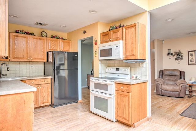 39 Cornwallis Rd, East Setauket, NY 11733 - kitchen featuring white appliances, a sink, light wood-style flooring, light countertops, and recessed lighting