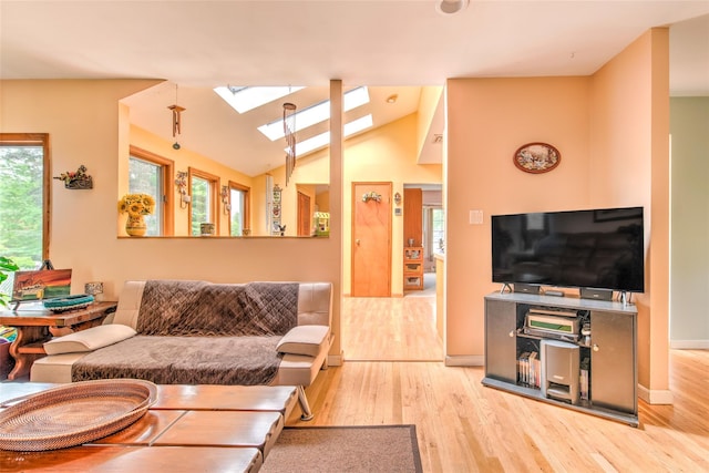 39 Cornwallis Rd, East Setauket, NY 11733 - living area with a skylight, wood finished floors, and lofted ceiling