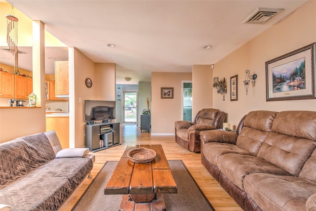 39 Cornwallis Rd, East Setauket, NY 11733 - living room with light wood-style floors, recessed lighting, and baseboards