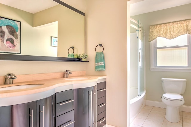 39 Cornwallis Rd, East Setauket, NY 11733 - bathroom featuring double vanity, tile patterned floors, toilet, and tub / shower combination