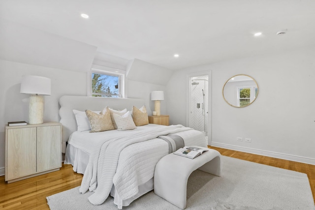 bedroom featuring vaulted ceiling, recessed lighting, light wood-style flooring, and baseboards