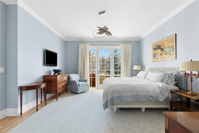 bedroom with ornamental molding, light wood-type flooring, and access to outside