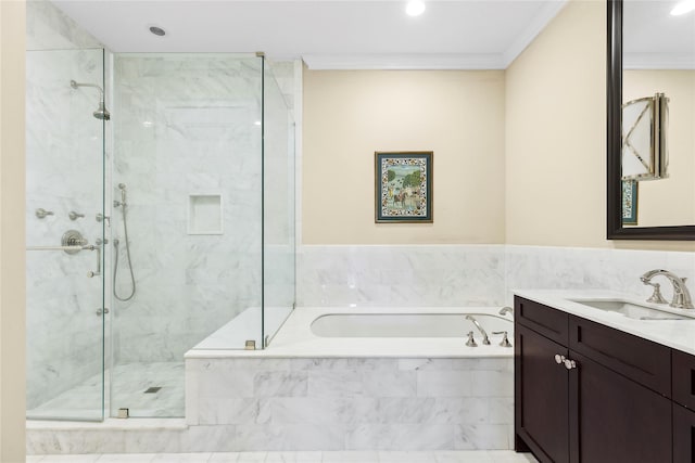 bathroom with ornamental molding, separate shower and tub, and vanity