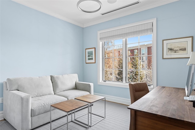 office with ornamental molding and light hardwood / wood-style floors